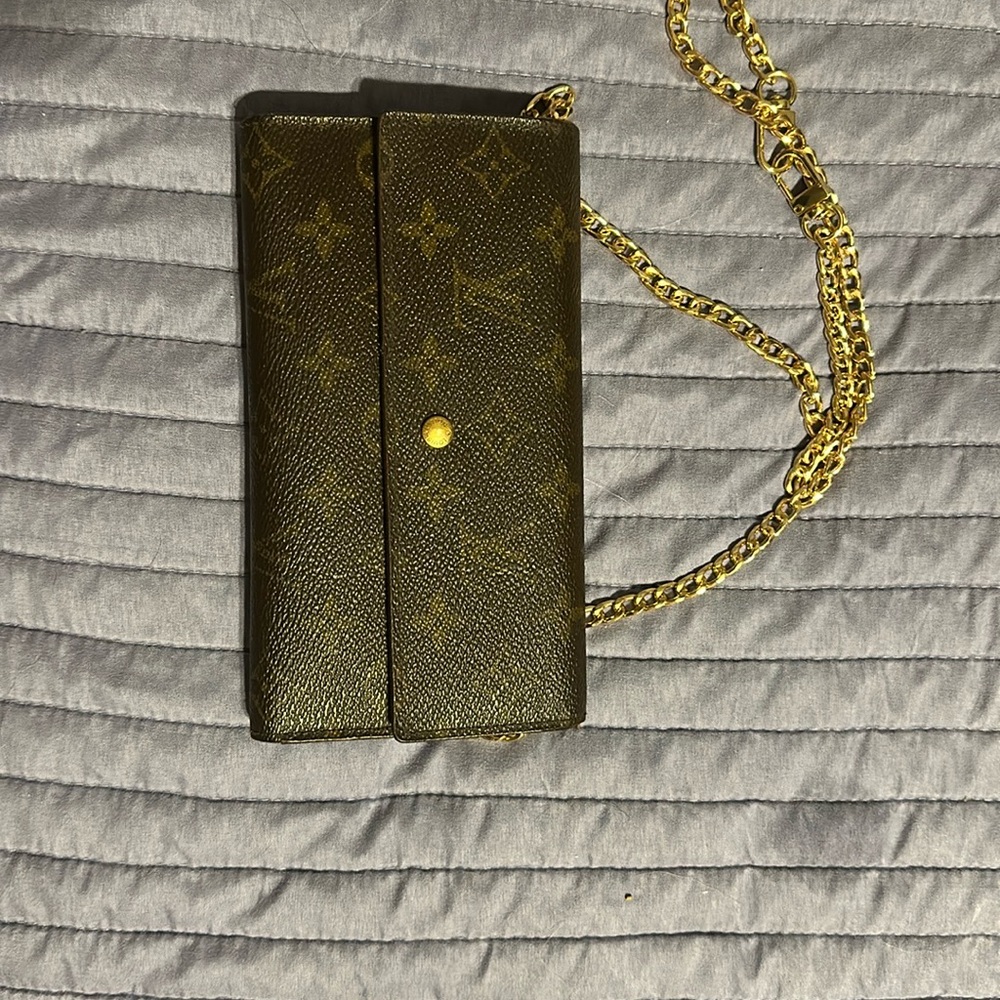 Louis Vuitton wallet monogram with after market removable chain.